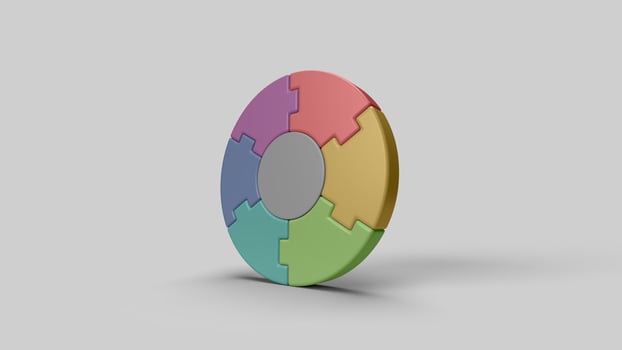 colored circular 3D puzzle pieces on the white backdrop, left view photo