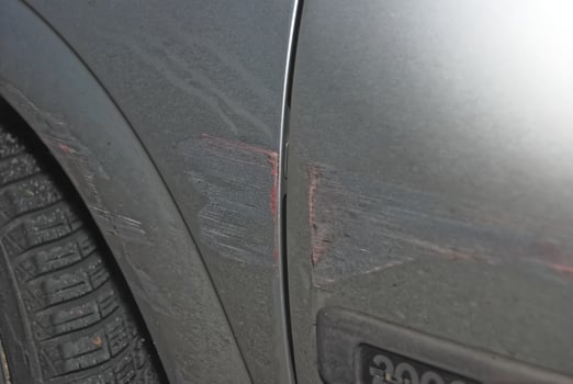 Car Door with Scratches and Paint Damage photo