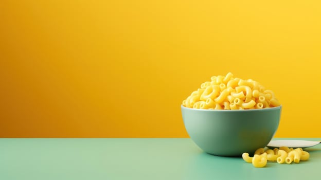 A bowl of macaroni with a spoon on the side photo