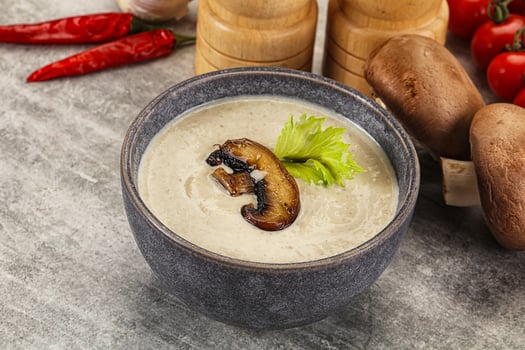 A bowl of soup with mushrooms and vegetables photo