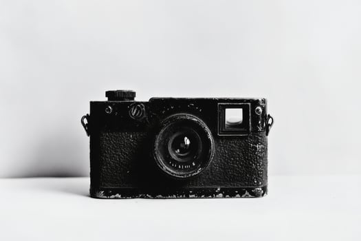 Classic black camera showcasing timeless design and craftsmanship. photo