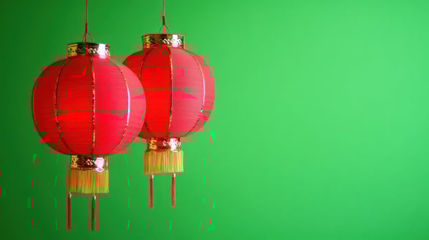Two red Chinese lanterns against a bright green background. photo