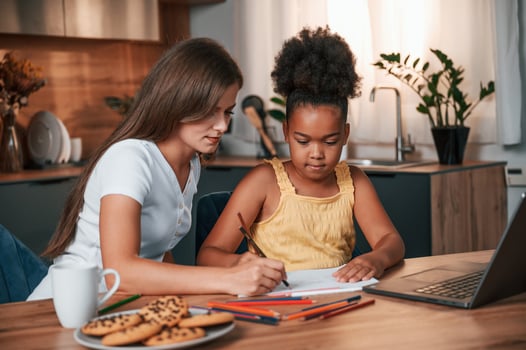 Learning ,how to draw. Young ,mother with her daughter is together at apartment photo