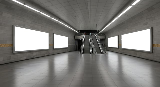 An empty subway station with two blank billboards photo