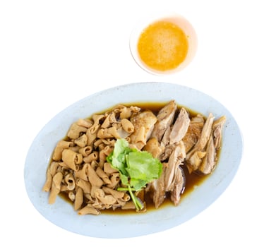 Chop boiled duck and stew intestine in brown soy soup dipping spicy sauce, focus selective photo