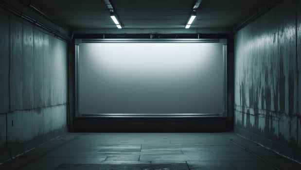 An empty room with a white screen in the middle photo