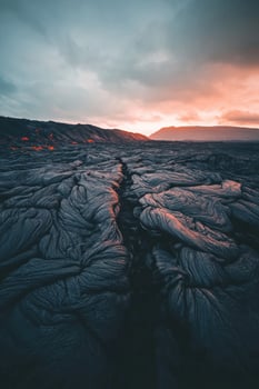 A sunset over lava in iceland photo