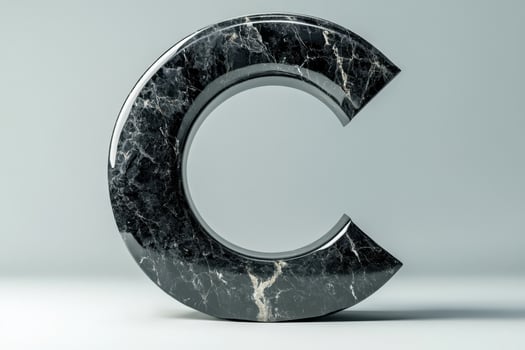 The letter C is made of marble and has a unique, curved shape photo