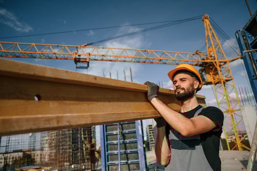 Man in uniform is working on the construction site photo