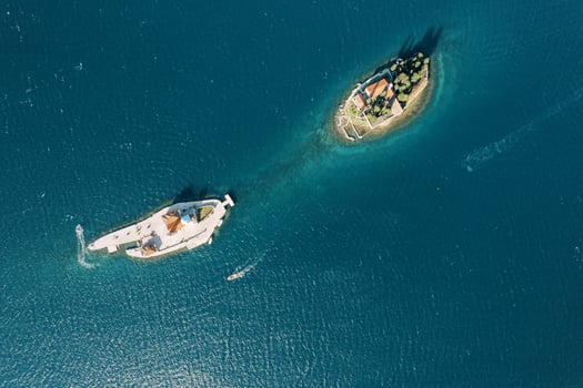Island of Gospa od Skrpjela is opposite the island of St. George in the Bay of Kotor. Top view photo