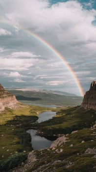 Rainbow over the mountains in yukon photo