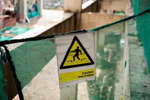 Caution Risk of Falling Sign on Construction Site photo