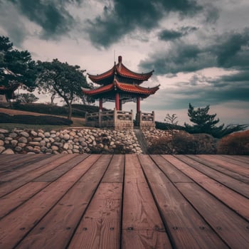An asian pagoda on a wooden deck with a cloudy sky photo