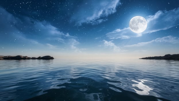 A full moon over the ocean with clouds and stars photo