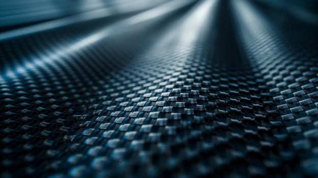 Close-up of sleek black carbon fiber surface showcasing intricate patterns and textures. photo