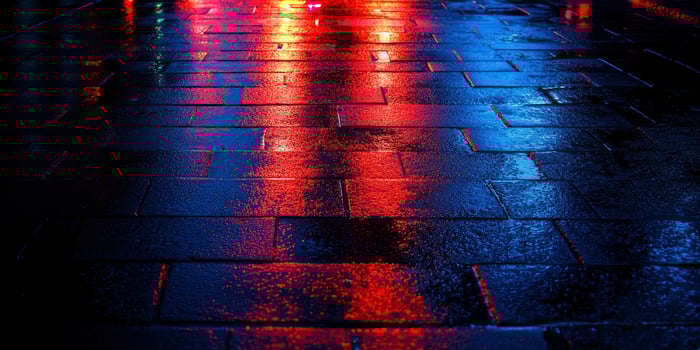 Walking on Wet City Pavement Reflecting Colorful Light After Rain photo
