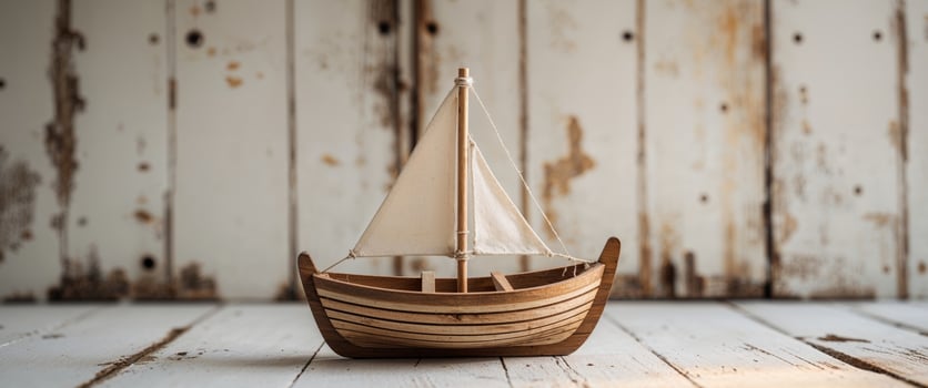 Wooden Toy Boat on Rustic Wooden Background photo