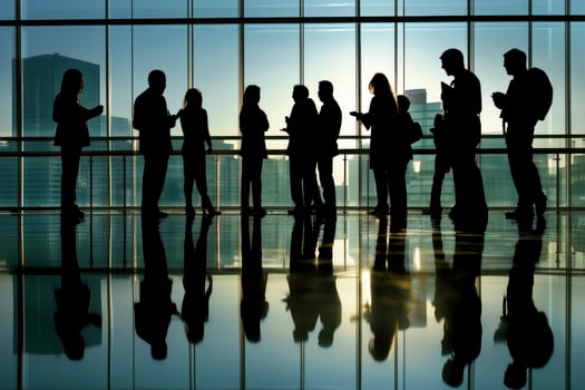 Business People Silhouettes Networking in Modern Building with Reflections photo