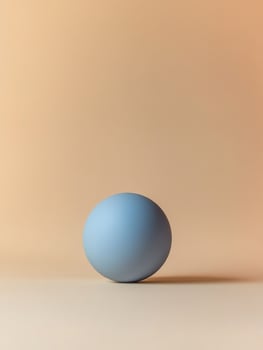 Bold minimalism with a blue sphere on a soft gradient background photo