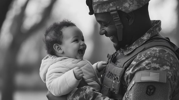 A black and white photo of a soldier holding a baby