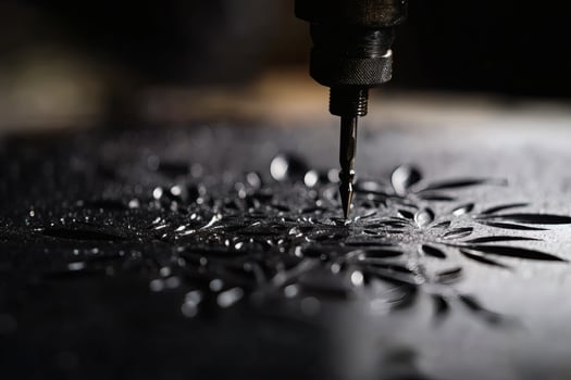 Crafting Intricate Designs Using Precise Engraving Tools in a Workshop. photo