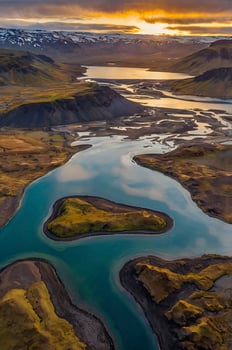 Aerial View of River Meandering Through Icelandic Highlands at Sunset photo