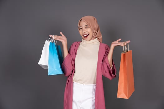 Hijab Female Carrying a Shopping Bag photo