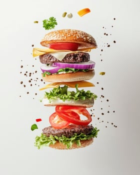 Exploded View of Delicious Burger with Fresh Ingredients Isolated on White photo