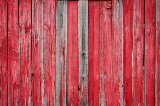 Red Painted Wooden Fence with Weathered Texture for Rustic Background photo