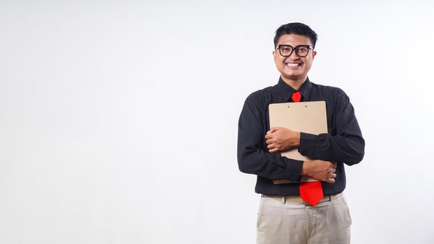 Confident Asian employee businessman corporate wearing formal clothes holding wooden clipboard isolated on white background photo