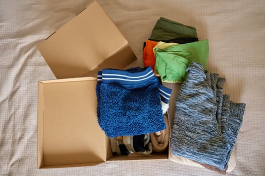 Boxes of Donated Clothes for Charity, top view photo