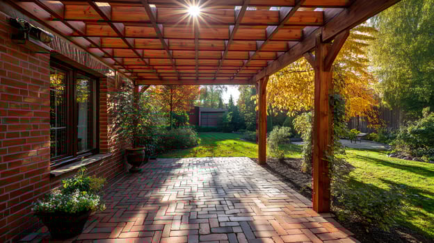 Wooden pergola providing shade on a brick patio in a lush garden photo