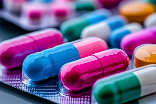 Colorful medical pills blister pack showing modern medicine and healthcare concepts photo