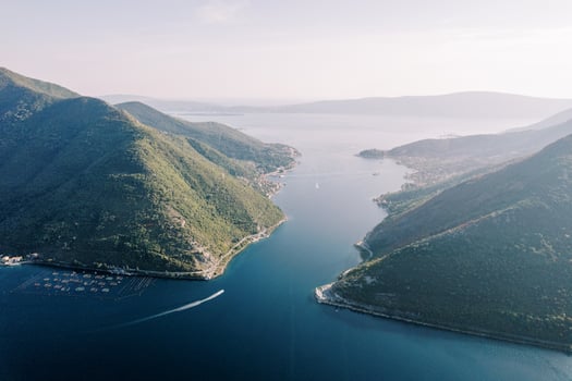 Panoramic view from a drone of the Bay of Kotor among green mountains. Montenegro photo