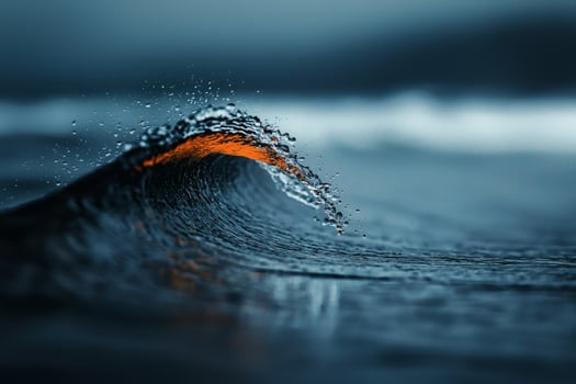 Ocean wave glimmers with fiery sunset hues photo