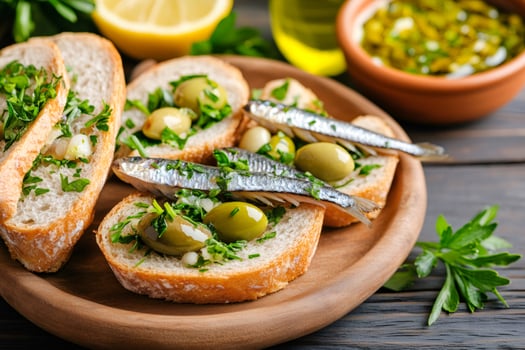 Delicious spanish tapas with anchovies, olives, and parsley decorating toasted bread photo
