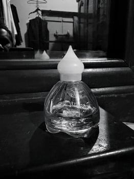 Black and White Photography of a Glass Perfume Bottle Elegant Fragrance Imagery and Perfume Bottle photo