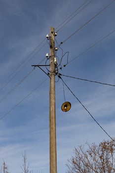 electricity post with blue sky background, close-up of photo
