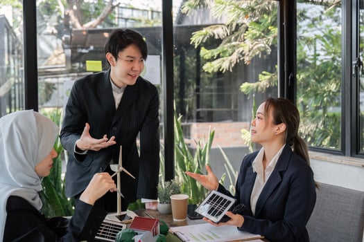Climate Action and Team Collaboration. Professionals discussing solar energy solutions in a business setting. photo