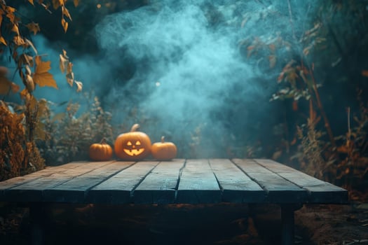 Halloween Jack O Lantern Pumpkins on Wooden Table with Fog photo