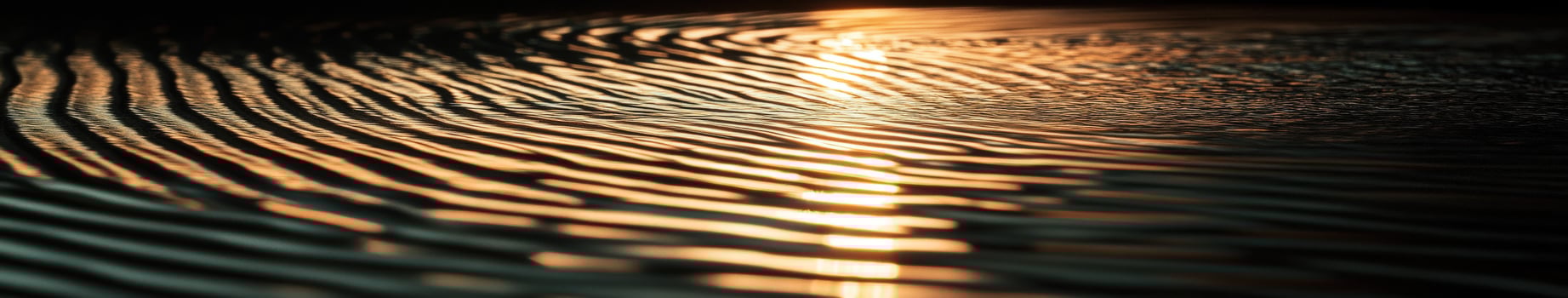 Sunlight reflecting off of waves in a dark water photo
