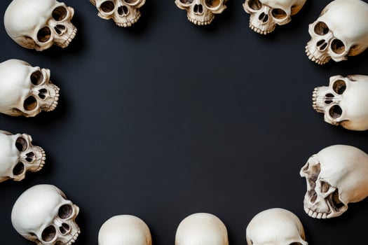 Arrangement of Skull Models on Dark Background Creating a Halloween Frame photo