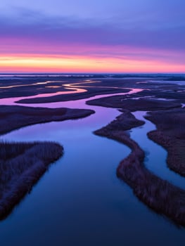 A purple sky and a river at sunset photo