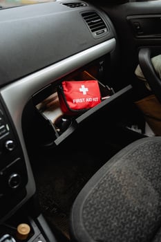 A first aid kit is conveniently stored in the glove box of the car, ensuring that in the event of any emergency, immediate assistance is readily accessible for all passengers and occupants photo