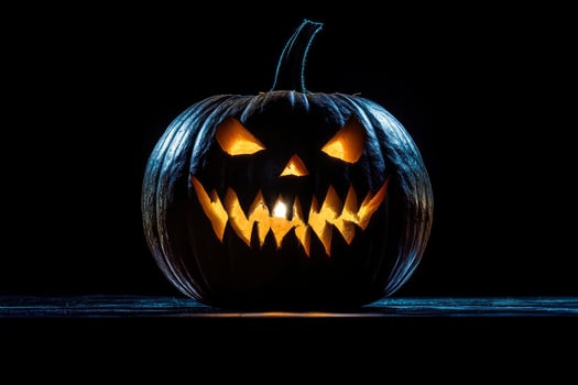 Glowing Carved Pumpkin with Spooky Face Ready for Halloween Night photo