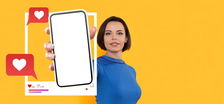 A confident influencer showcases a smartphone with an empty screen, encouraging online engagement. The bright background emphasizes social media connectivity and chat applications. photo