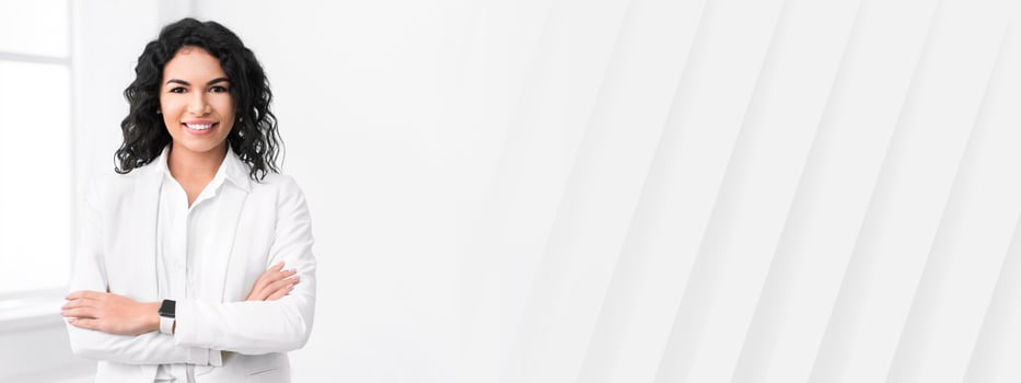 Confident Businesswoman. Happy mexican lady smiling at camera with crossed arms. Copy space photo