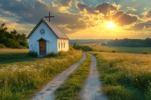 Country road leading to small church at sunset in scenic landscape photo