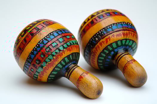 Colorful maracas resting on white background showing latin american culture photo