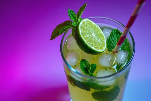 A glass of lemonade with lime and mint photo